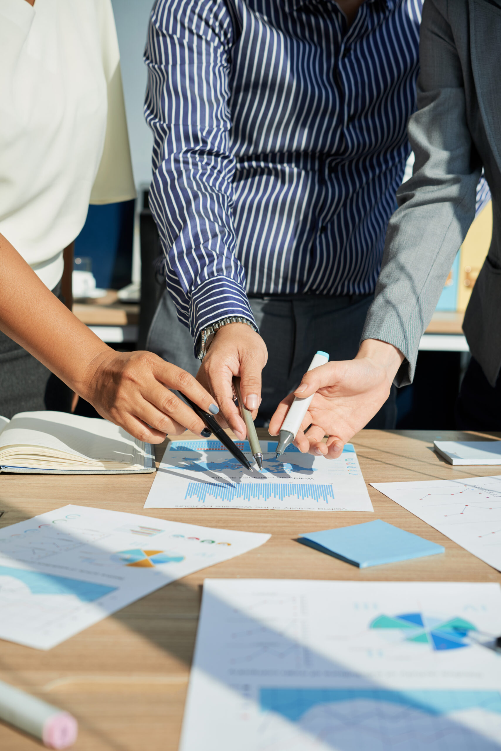 Cropped image of business executives analyzing financial statistics